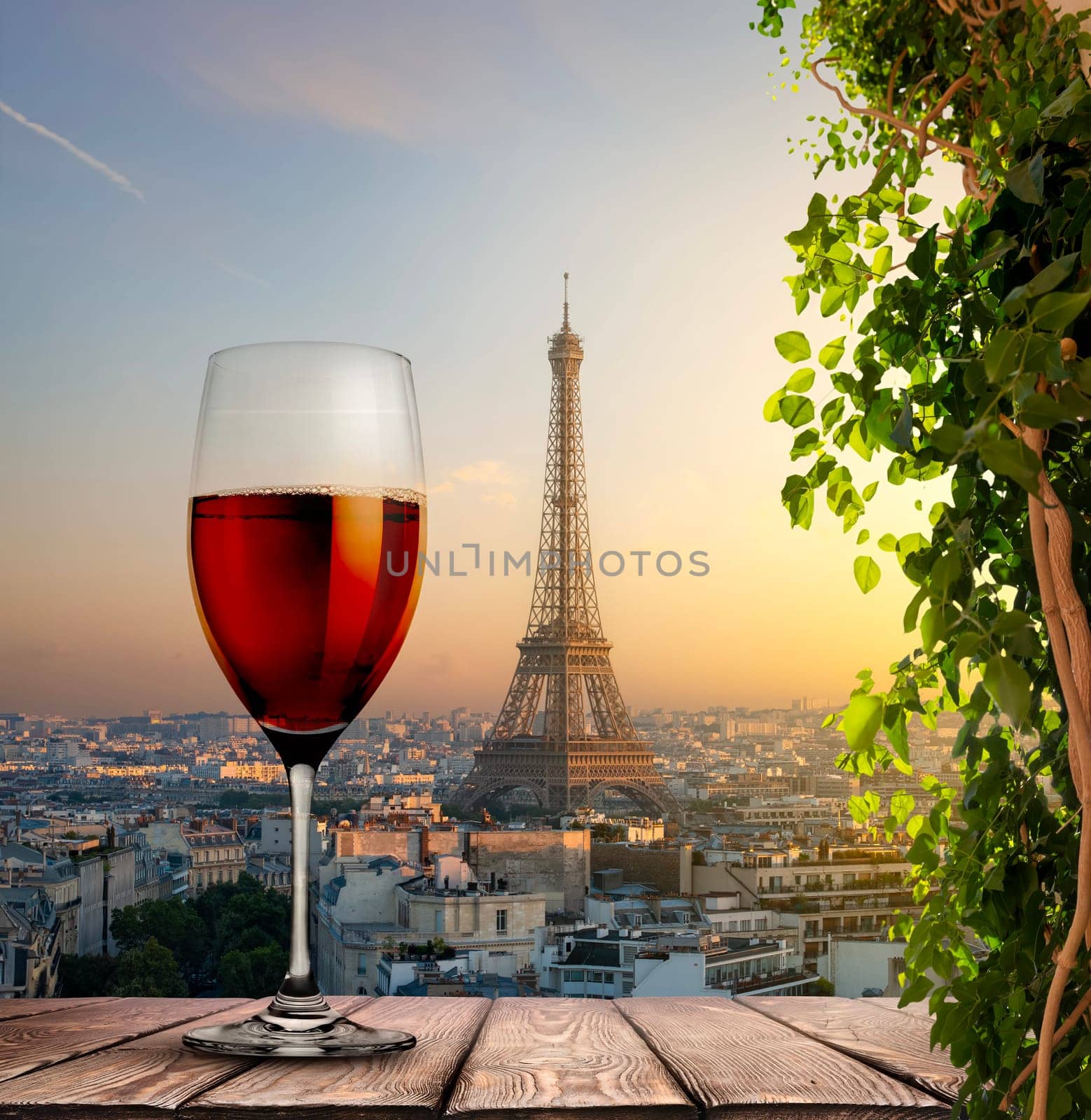 Glass of red wine with a view of the Eiffel Tower in Paris