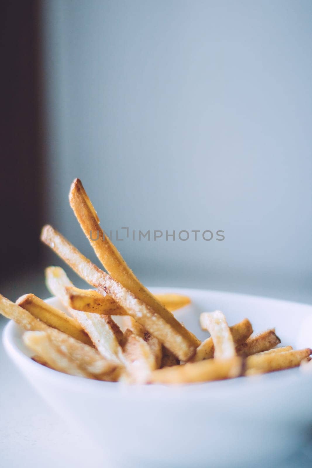 rustic food and homemade cooking styled concept - just cooked french fries served, elegant visuals