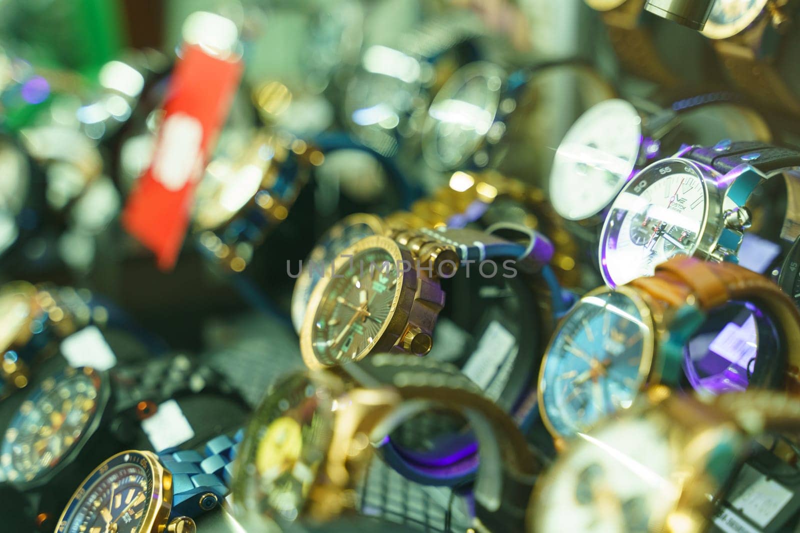 Klaipeda, Lithuania - August 10, 2023: A collection of various watches, each displaying a different color yet all in a bunch together.