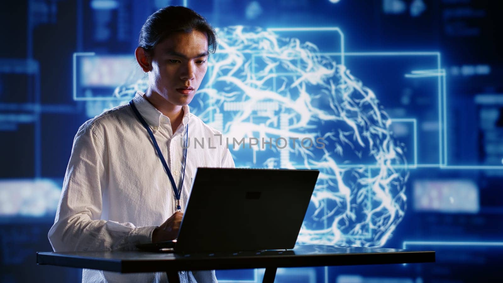 Admin using laptop to visualize artificial intelligence neural networks made up of interconnected nodes using augmented reality technology. Supervisor oversees AI systems processing information
