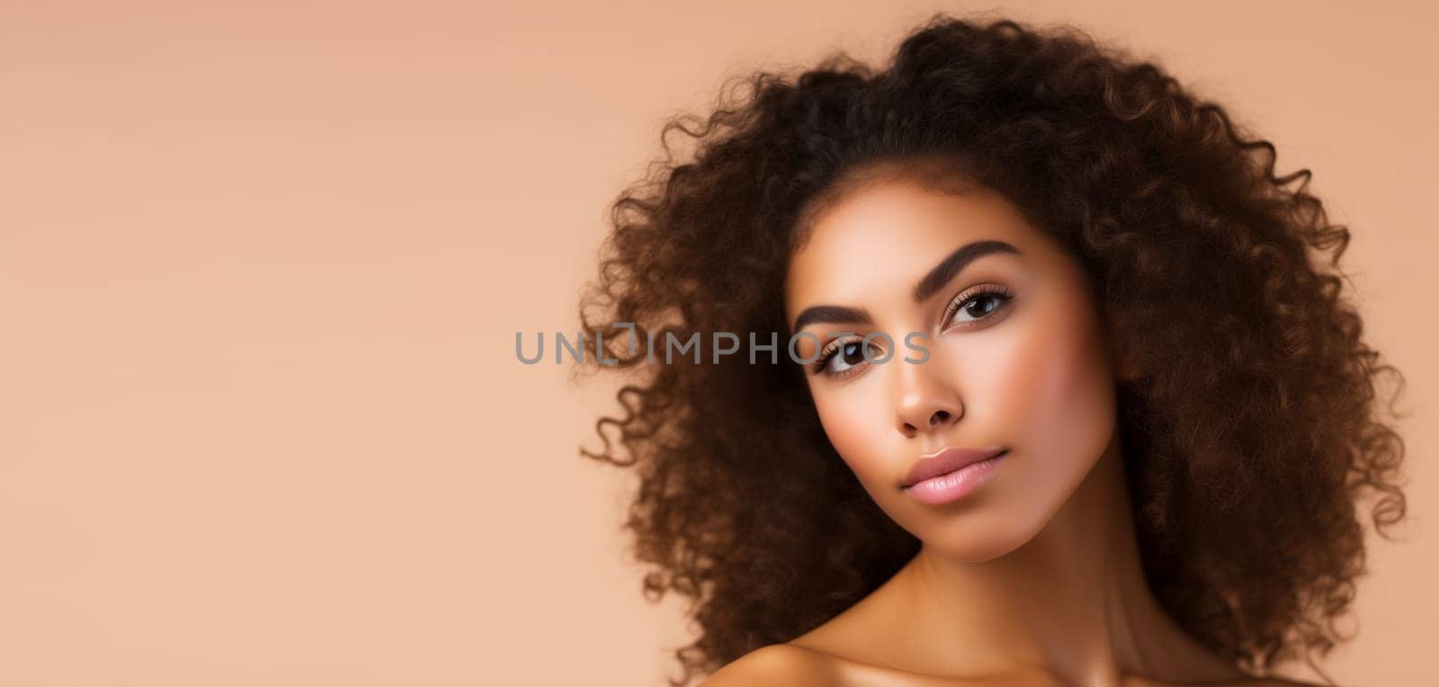 Beauty portrait of pretty young African woman with curly hair, beautiful lovely model posing on beige studio background