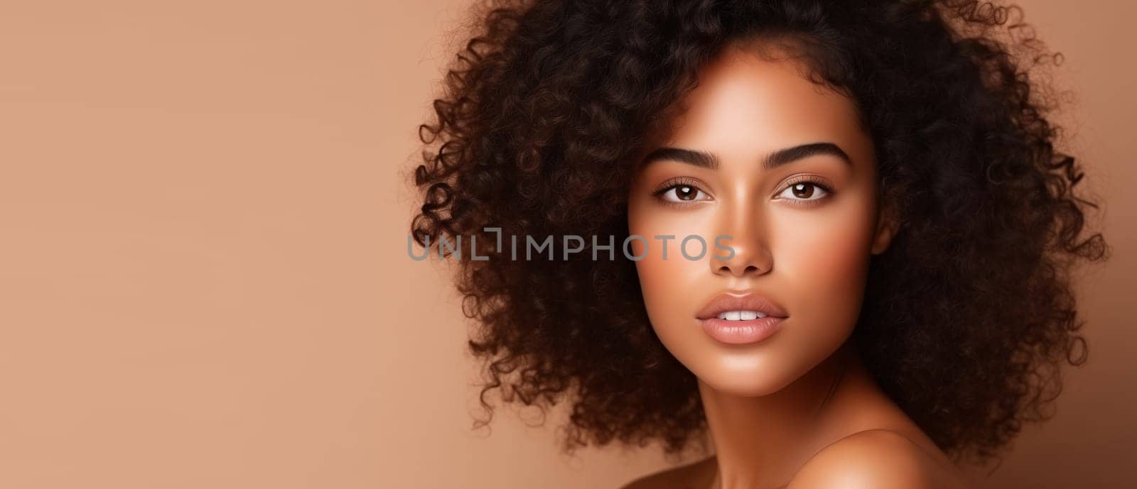 Beauty portrait of pretty young African woman with curly hair, beautiful lovely model posing on beige studio background