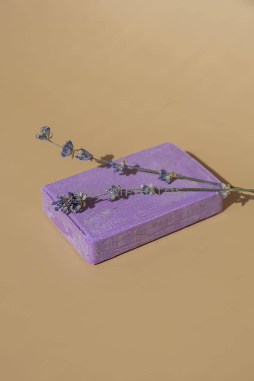 Handmade aromatic spa lavender soap. Natural additives and extracts. Bar of lavender soap with dried flowers. Beauty treatment product herbal ecological organic cosmetics. Copy space