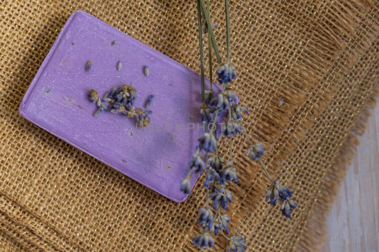 Handmade aromatic spa lavender soap. Natural additives and extracts. Bar of lavender soap with dried flowers. Beauty treatment product herbal ecological organic cosmetics by anna_stasiia