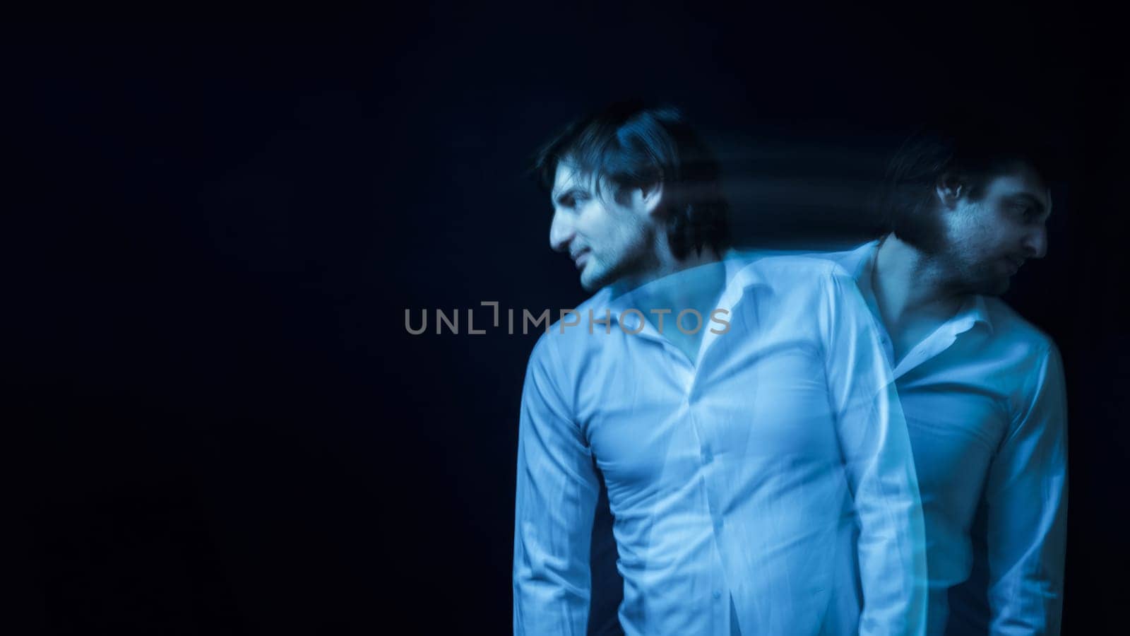 schizophrenic blurred portrait of psychopathic man with mental disorders and disorders on dark background
