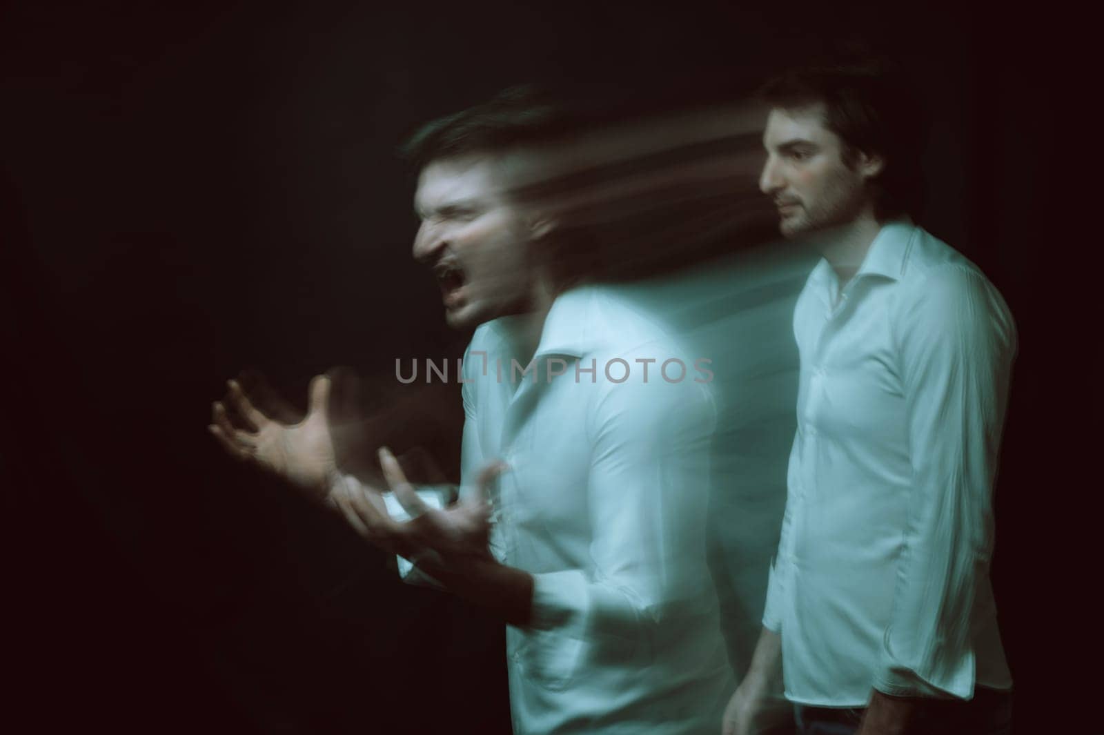 schizophrenic blurred portrait of psychopathic man with mental disorders and disorders on dark background
