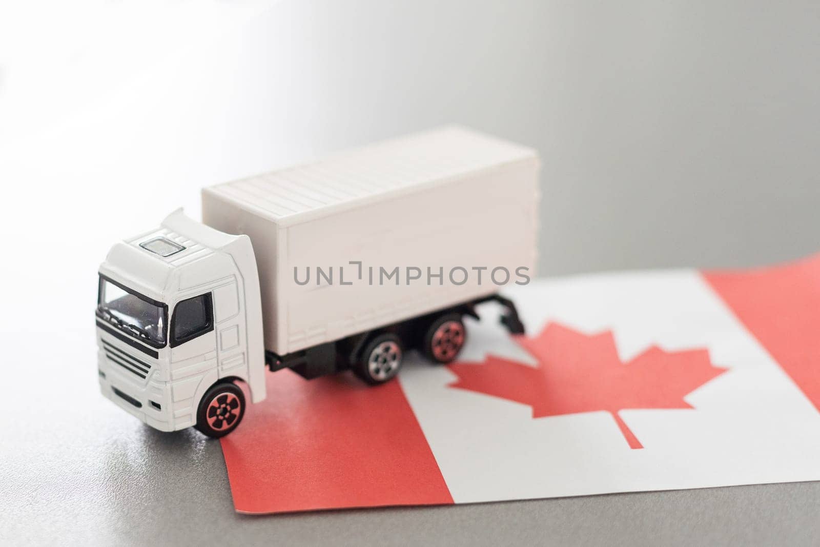 Symbol of National Delivery Truck with Flag of Canada. National Trucking Icon and Canadian flag. High quality photo