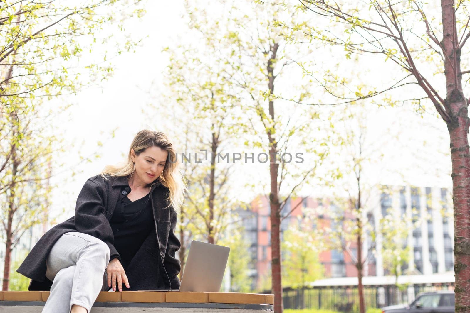 Young woman working at a remote job in a cafe. High quality photo