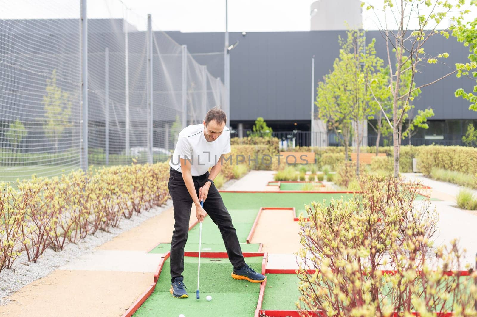 Minigolf player detail on green grass. High quality photo