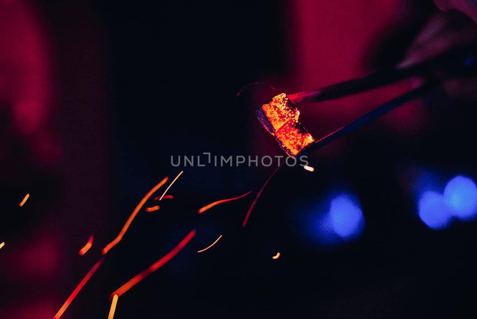 hot coals and red sparks for Shisha with blurred background