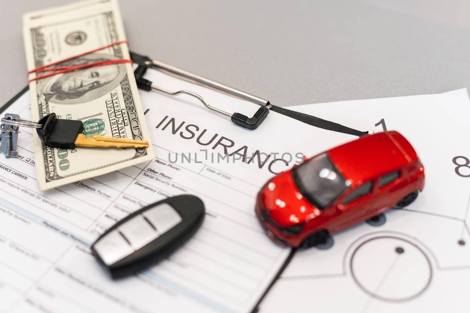 Car insurance form with car key. High quality photo