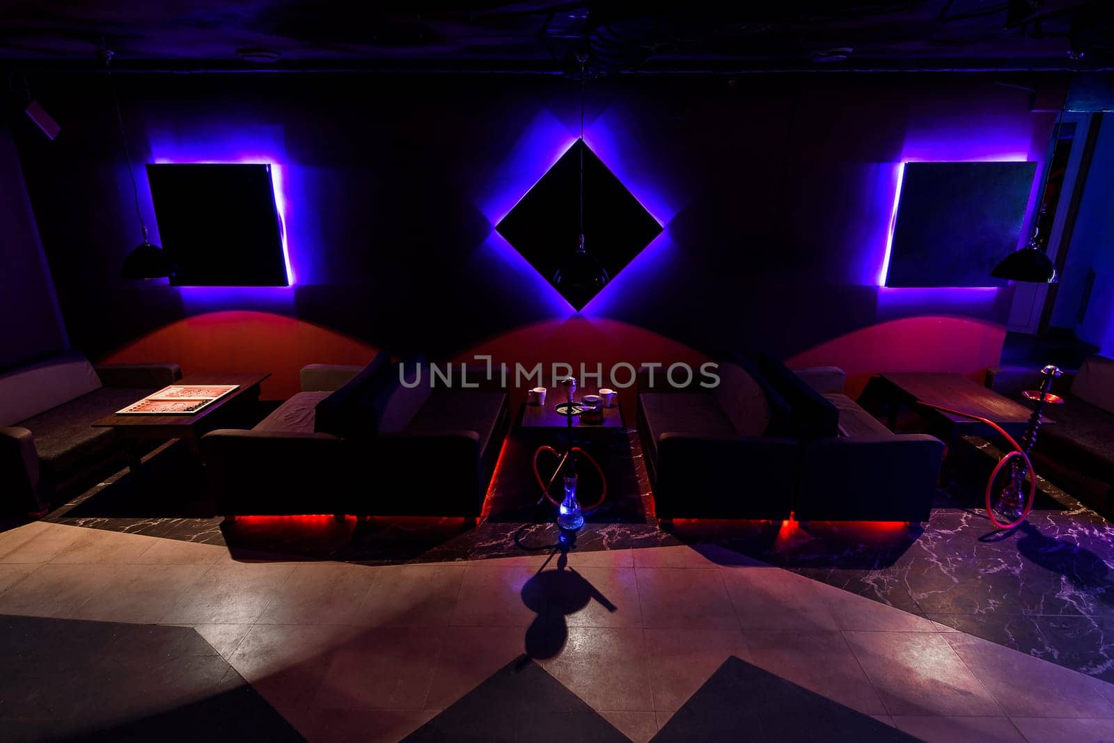 traditional lounge with a hookah in Asia with a beautiful dark, with glow design interiors