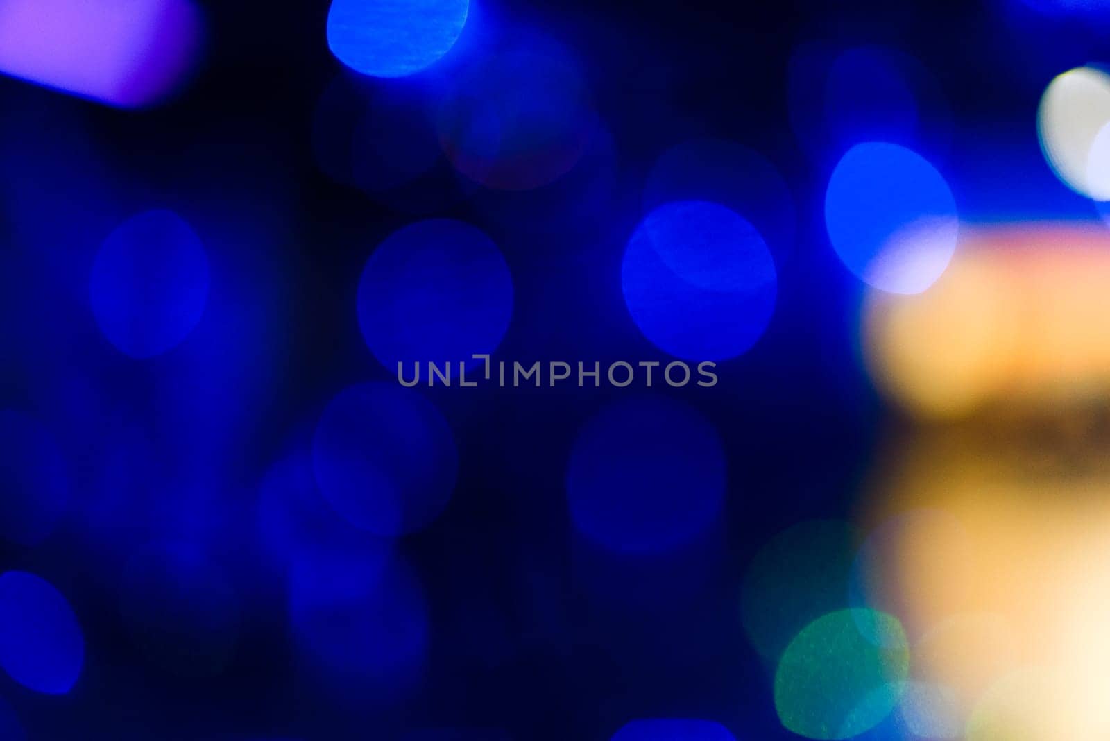 background with blue bokeh circles on a dark