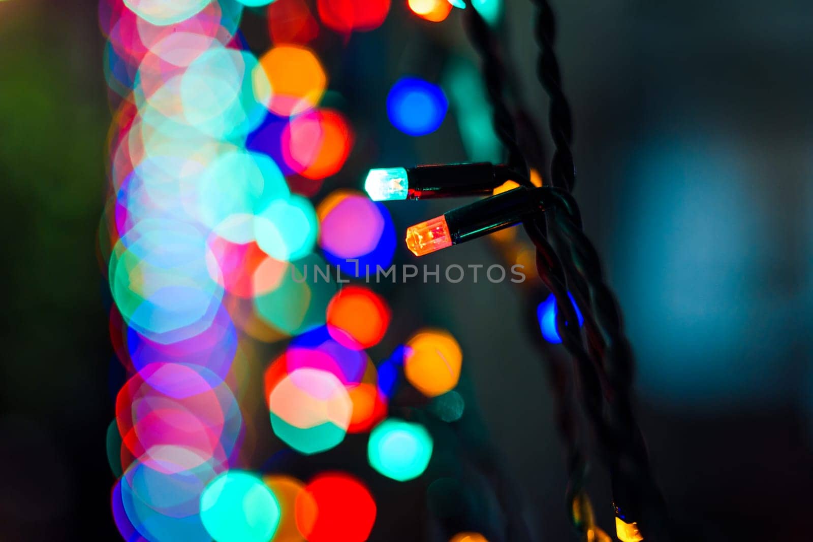 colored lights Christmas garland with beautiful blurred bokeh