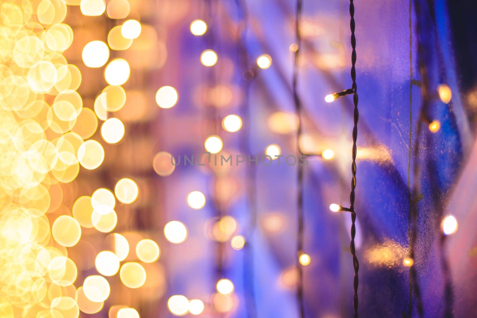 Christmas garland hanging on the wall, bokeh