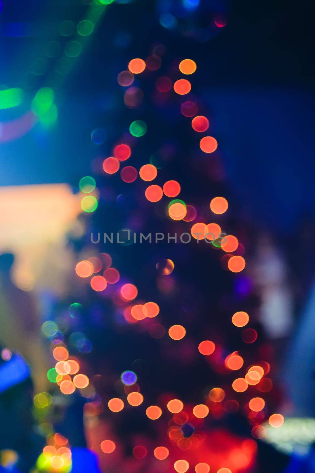 Christmas tree out of focus, colorful background bokeh