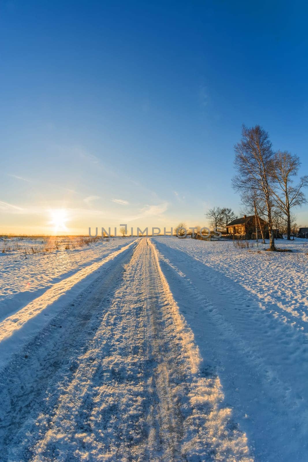 rural landscape in winter, the road house on a frosty Sunny day