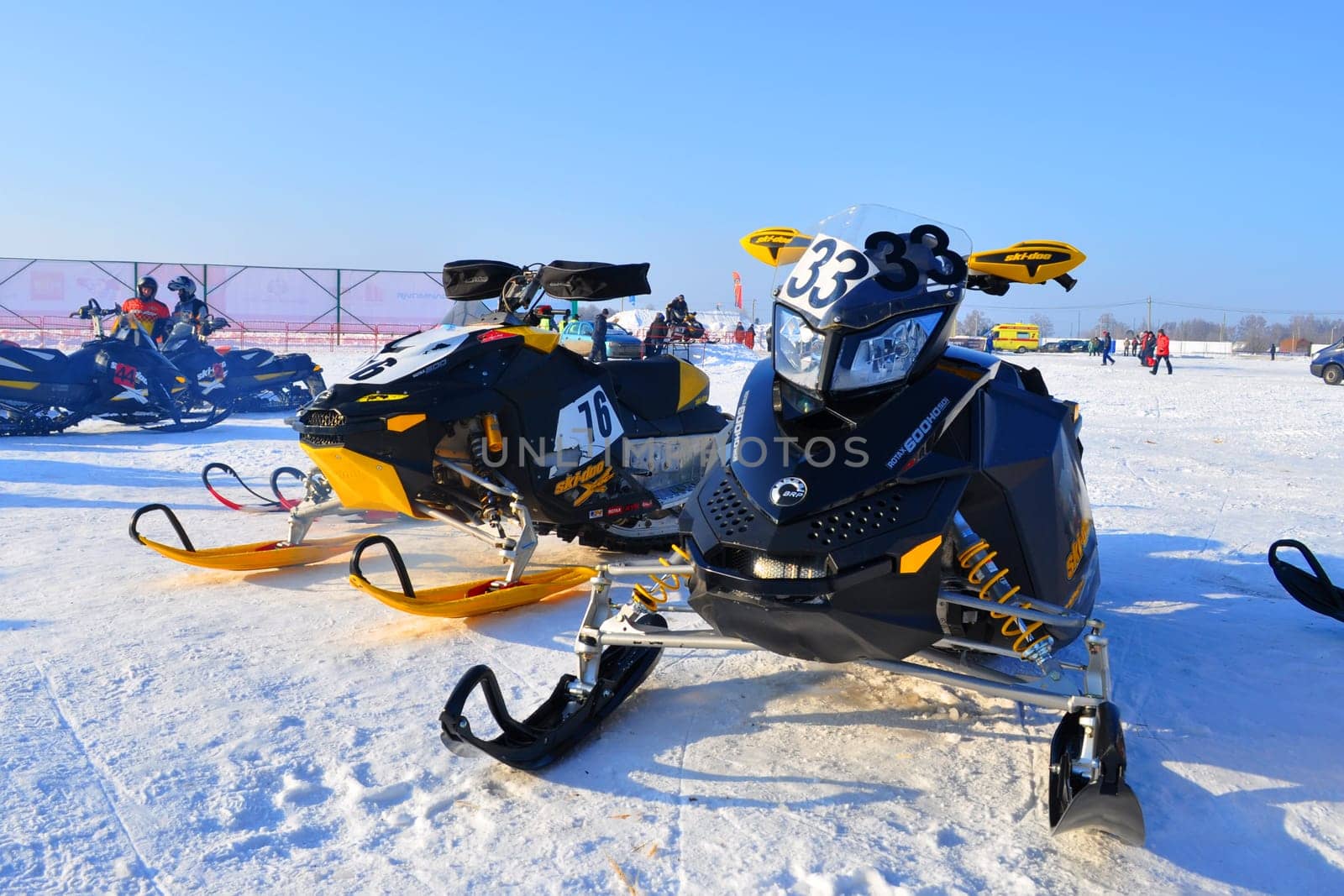 snowmobiles before the race stand on a cold winter day, Russia