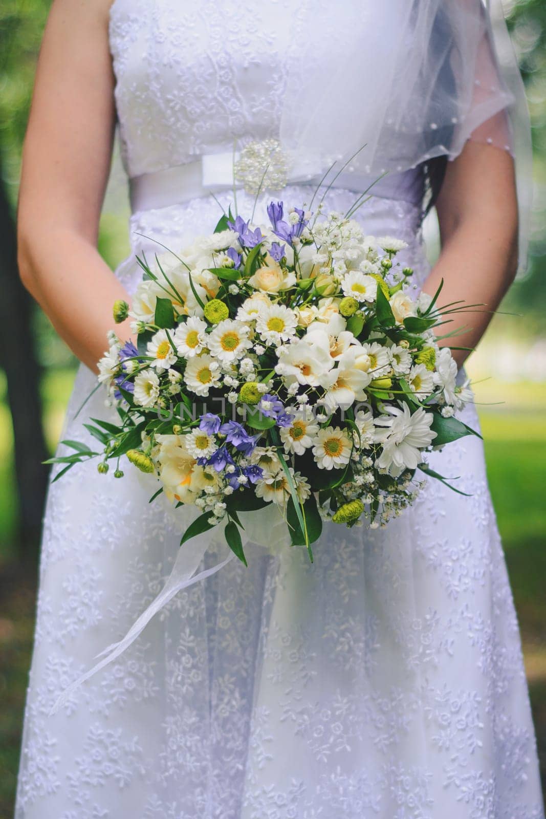 beautiful wedding bouquet in the hands of the bride