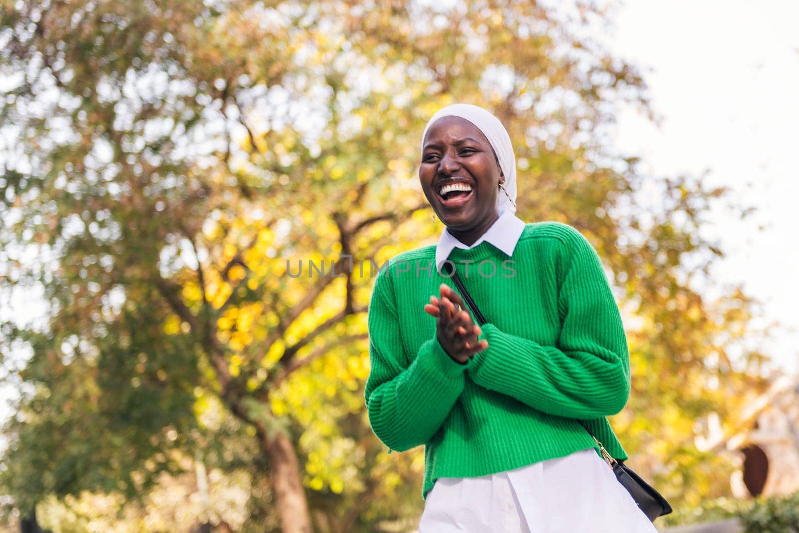 happy muslim black woman laughing funny by raulmelldo