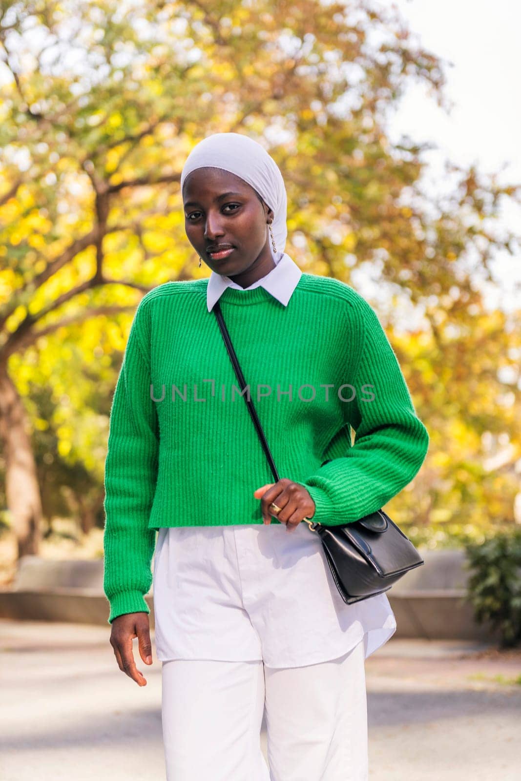 fashionable muslim black woman looking at camera by raulmelldo