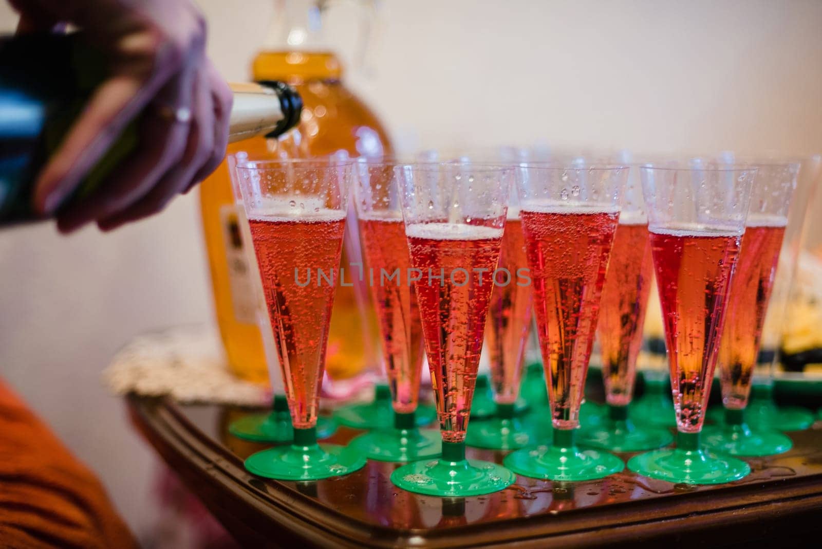 red wine poured in a variety of plastic cups