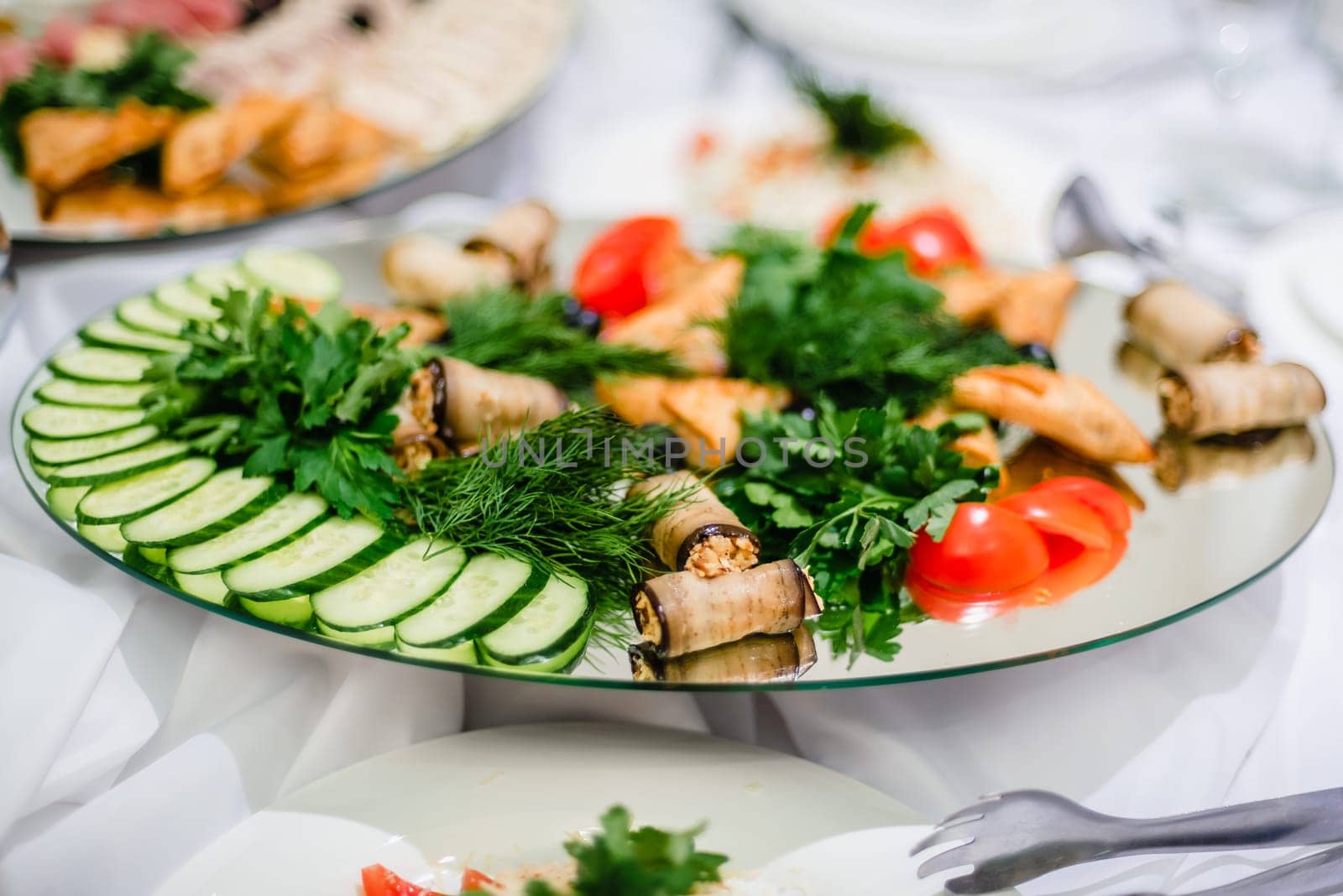 dinner in the restaurant from fresh cucumbers, tomatoes, parsley, dill and meatballs with rice