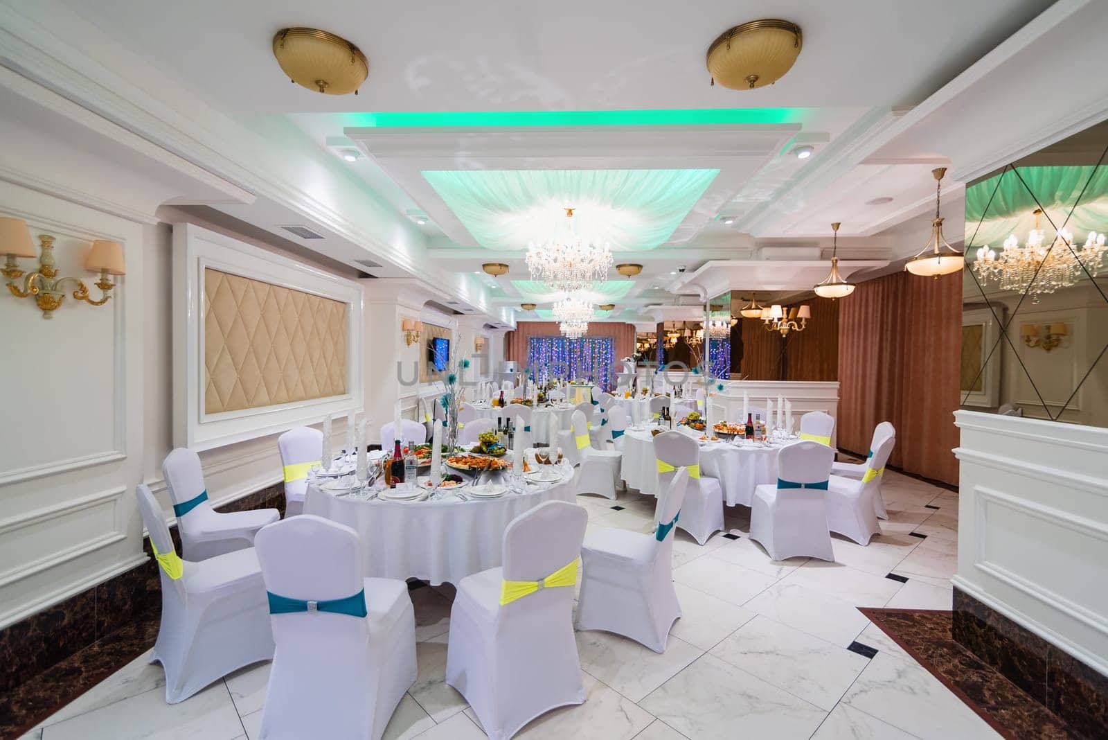 Banquet hall luxurious bright white decorated for your wedding reception