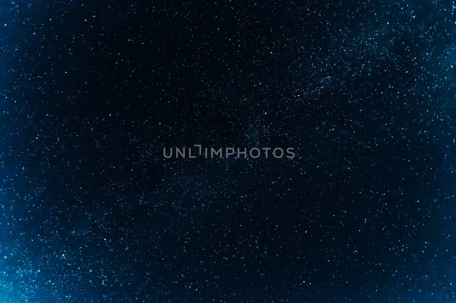 milky way with many bright stars on a dark blue background