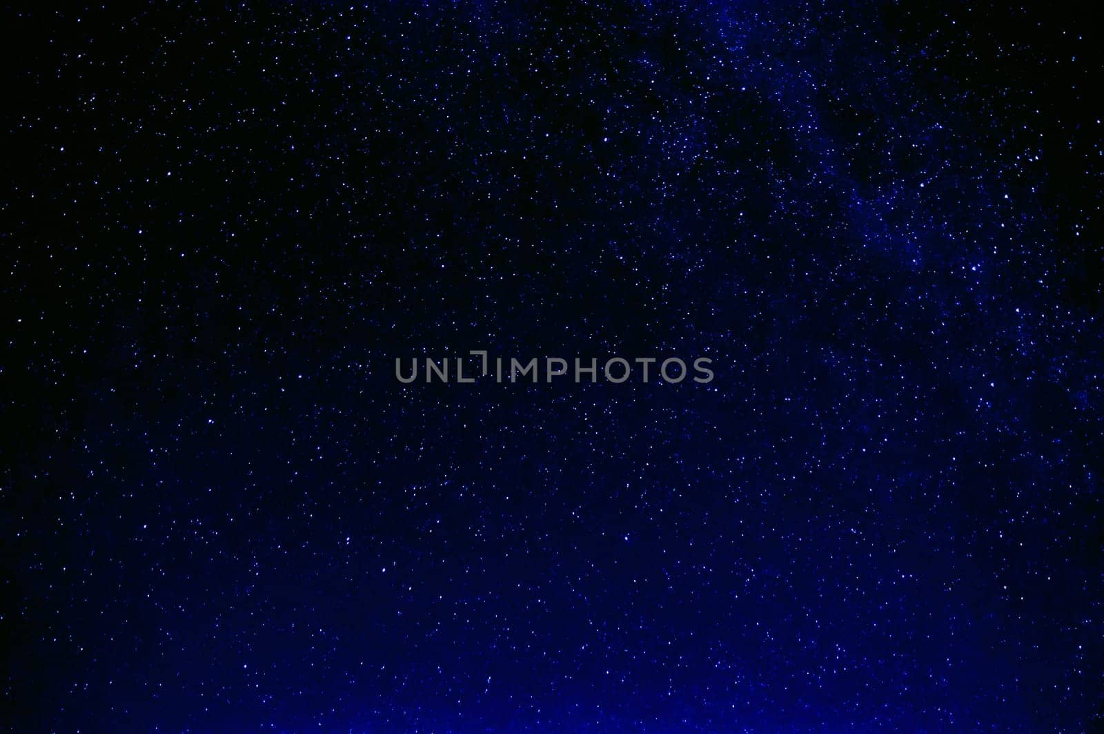 milky way and so many stars in the night dark blue sky