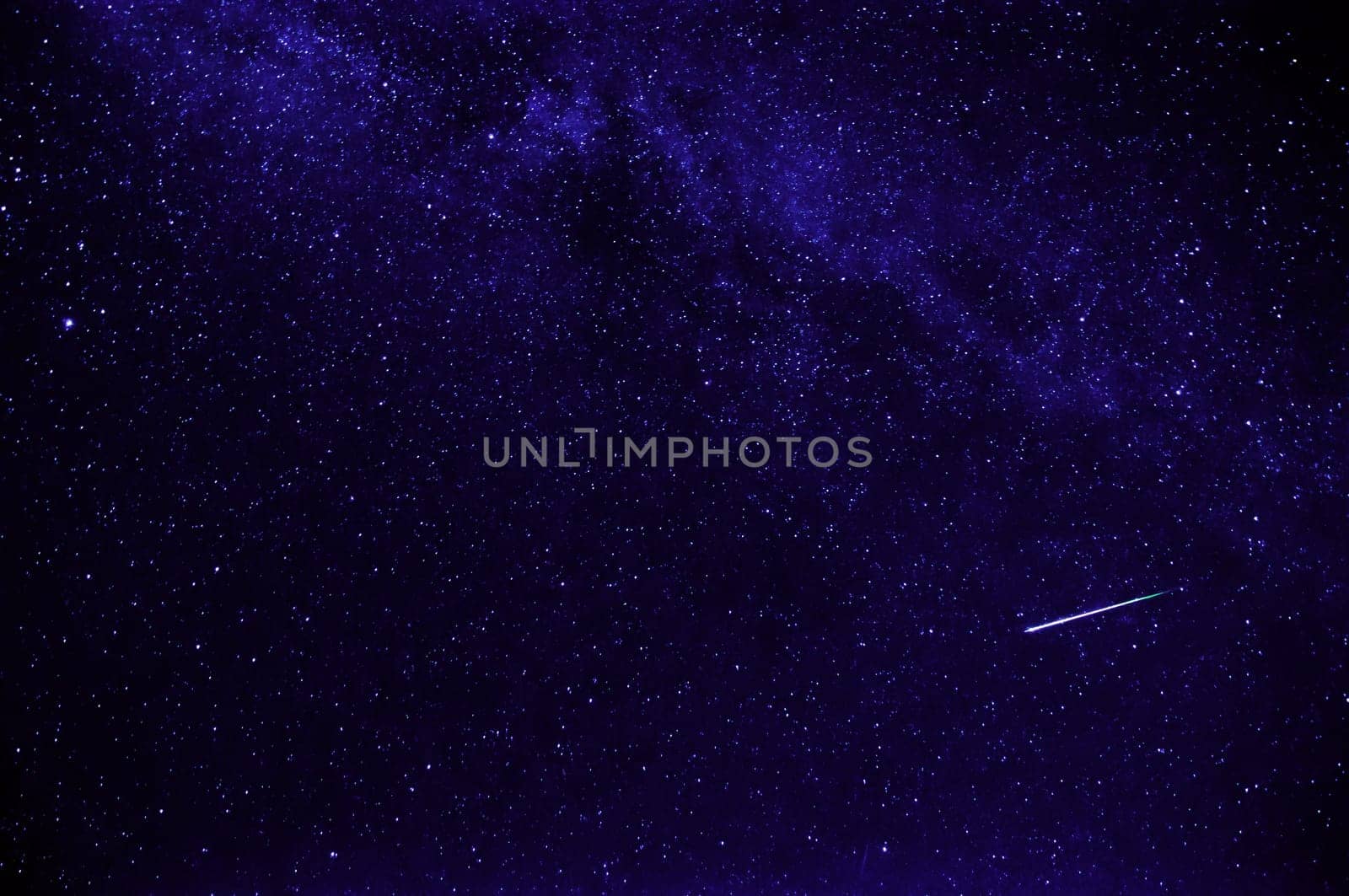 purple night starry sky with shooting star and milky way