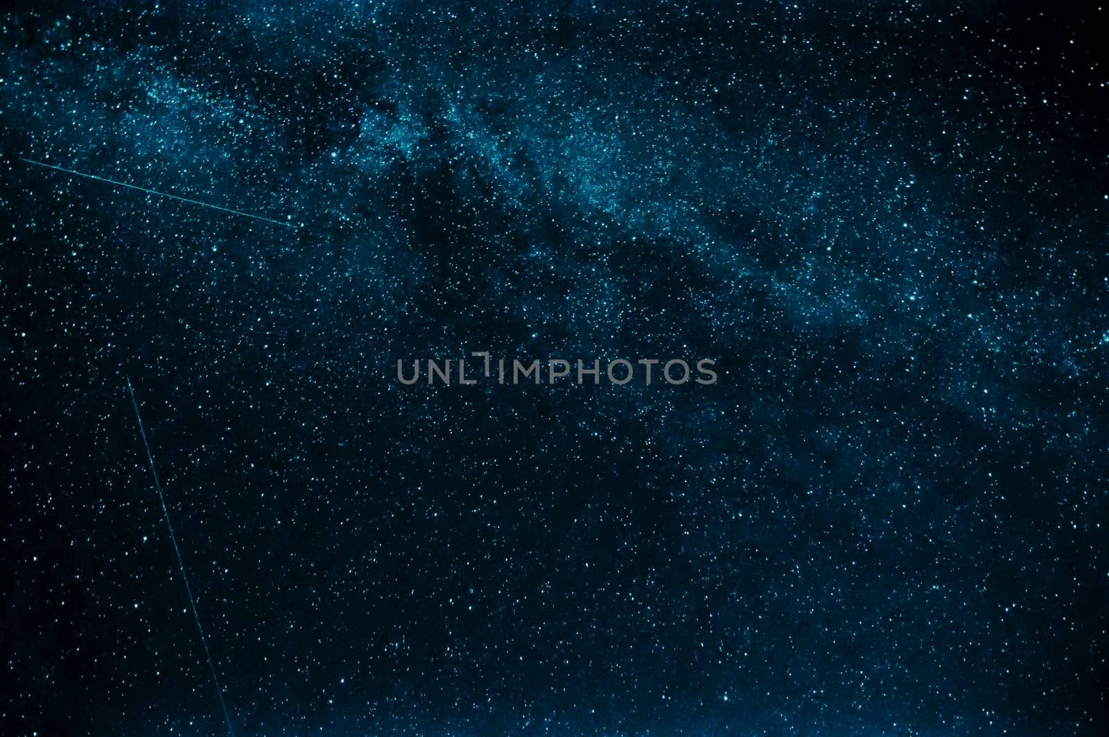 milky way and shooting stars on a background of blue night sky