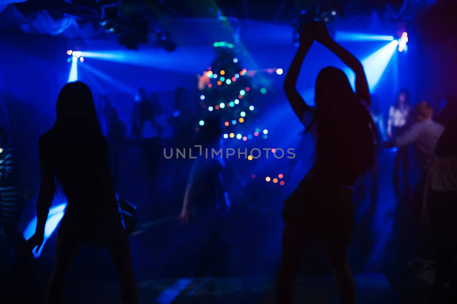 silhouette of a go-go dancer girl on stage in a nightclub