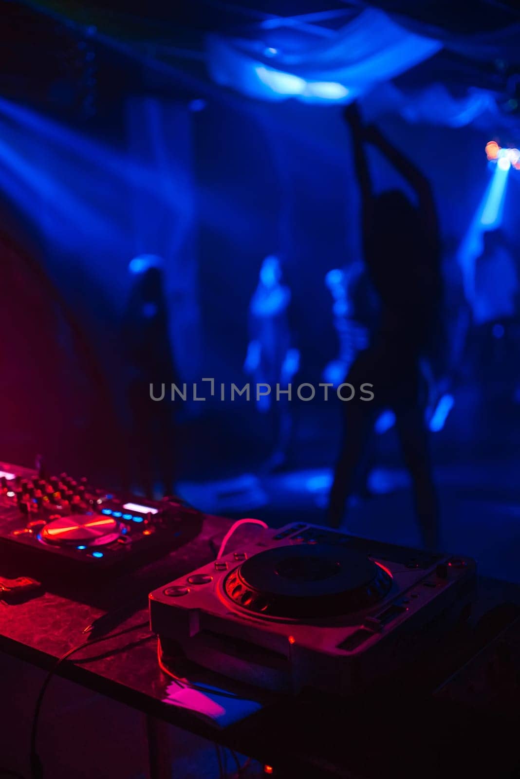 silhouette of a go-go dancer girl on stage in a nightclub