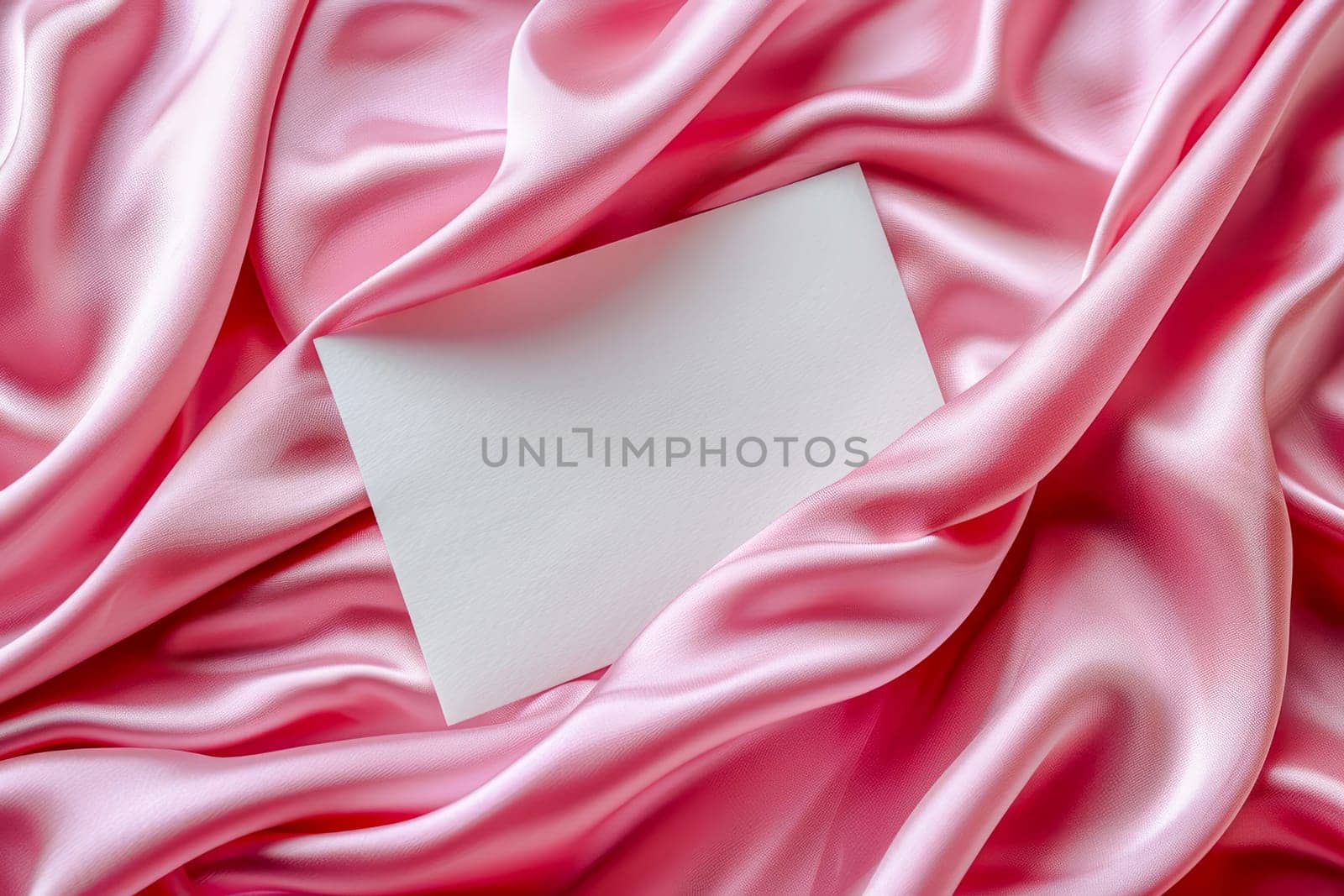 Minimalist aesthetic mockup from white blank A5 letterhead on pink silk fabric. by OlgaGubskaya