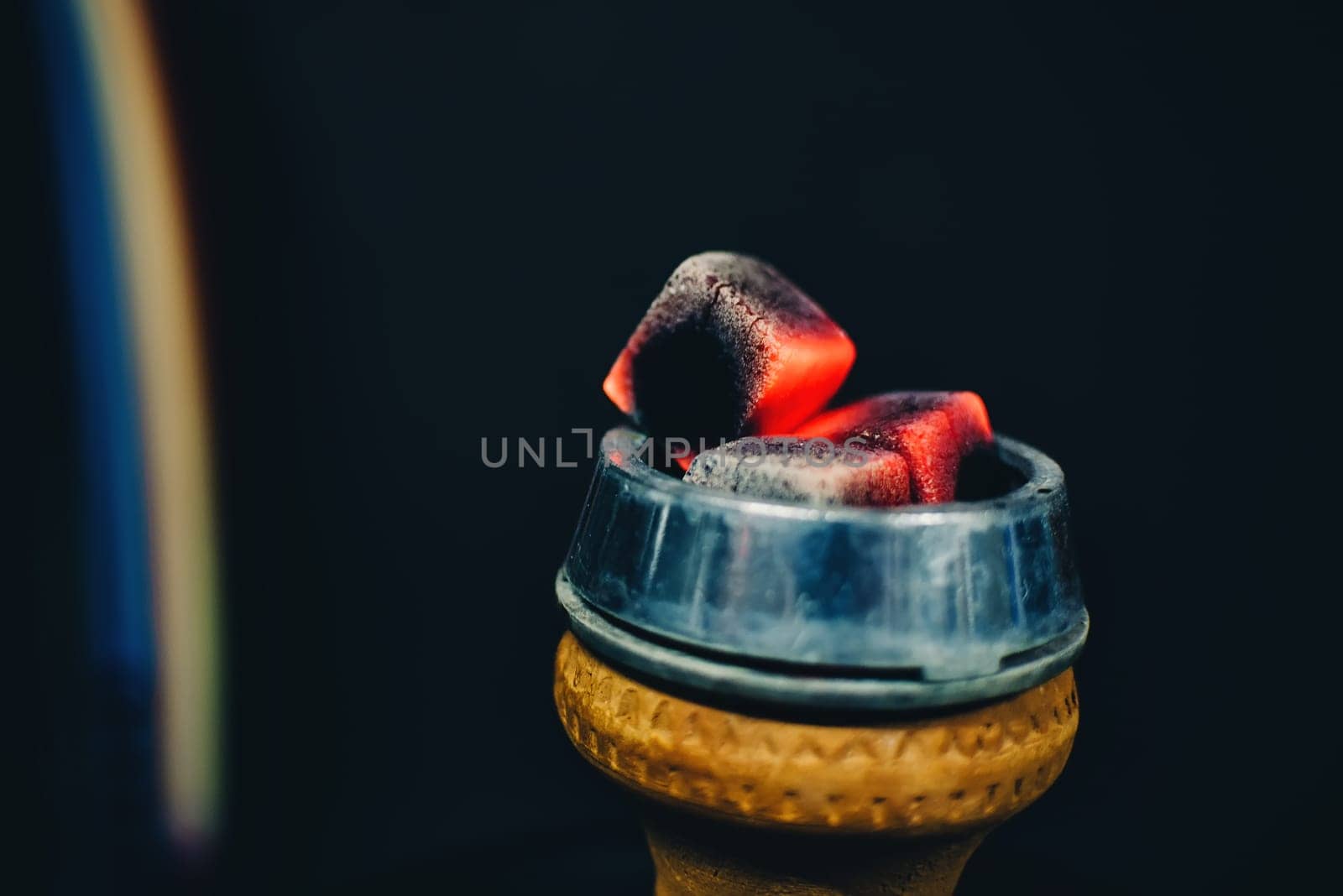 coals on the bowl of the hookah and heated red for tobacco Smoking closeup