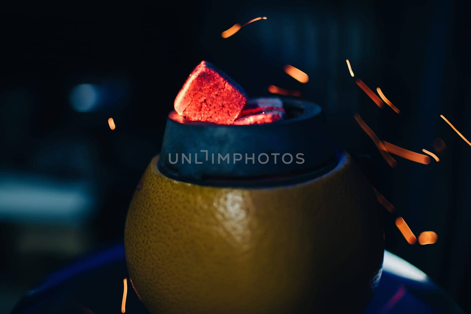 coals in the hookah fruit bowl of Smoking hot red with bold sparks