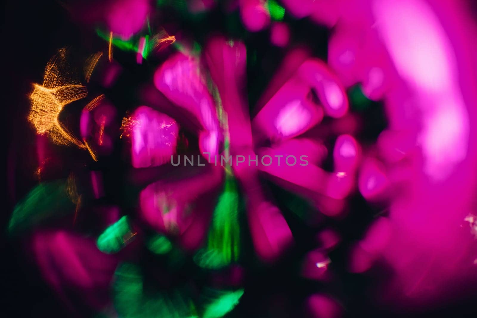 abstract pattern and bright pink purple and green glow in a circular shape and the blurred background