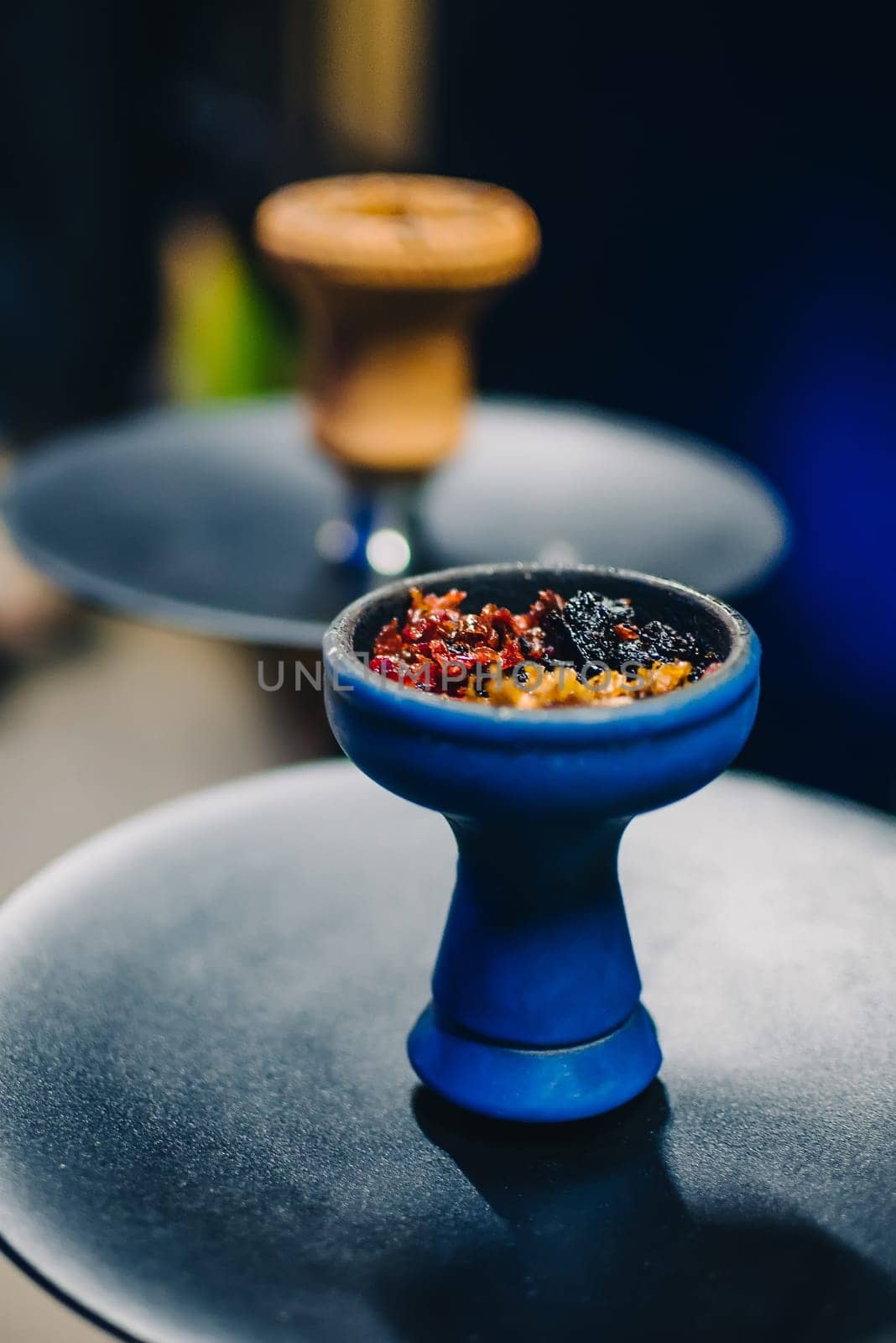 tobacco are mixed in the bowl of the hookah for traditional Asian holiday and Smoking