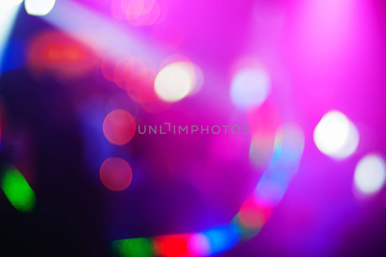 pink colored background with bright abstract blurred spots