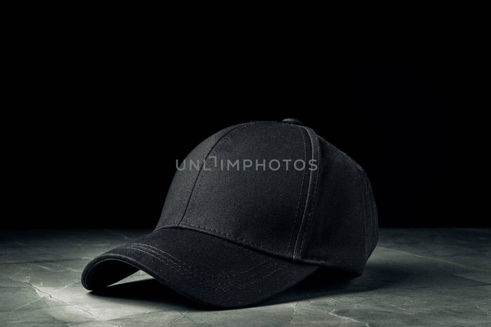 Baseball cap against black background studio shot close up
