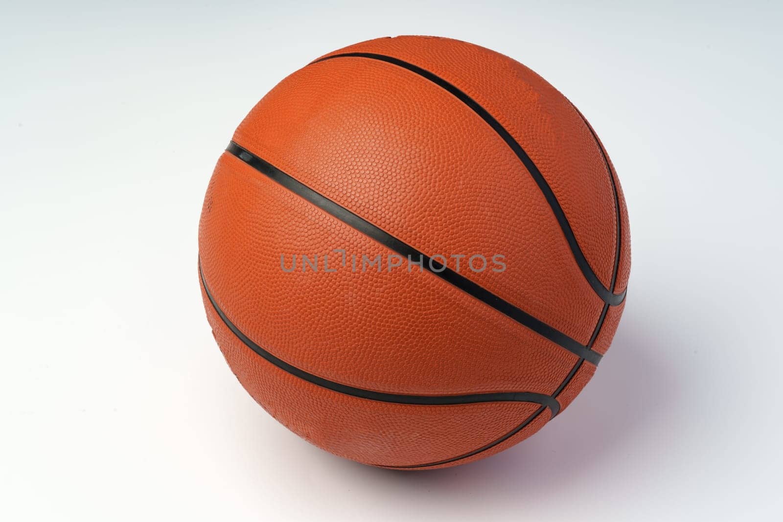 New orange basketball ball isolated on white by Fabrikasimf