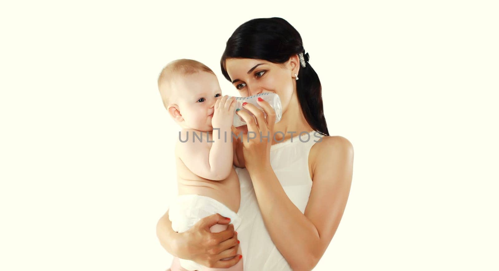 Happy mother feeding from bottle her baby on white background by Rohappy