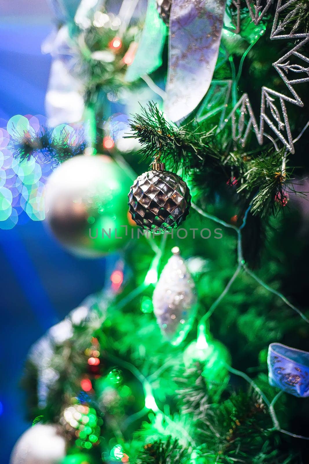 Christmas decorations of toys and garlands with a beautiful background of new year tree