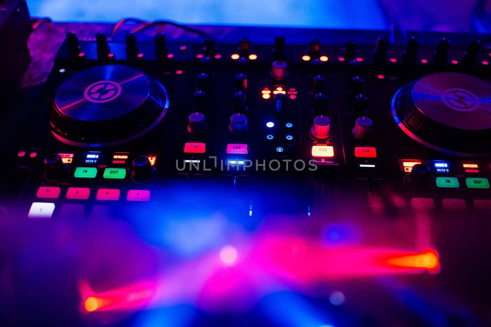 music professional mixer DJ for mixing music with a bright and colorful background closeup