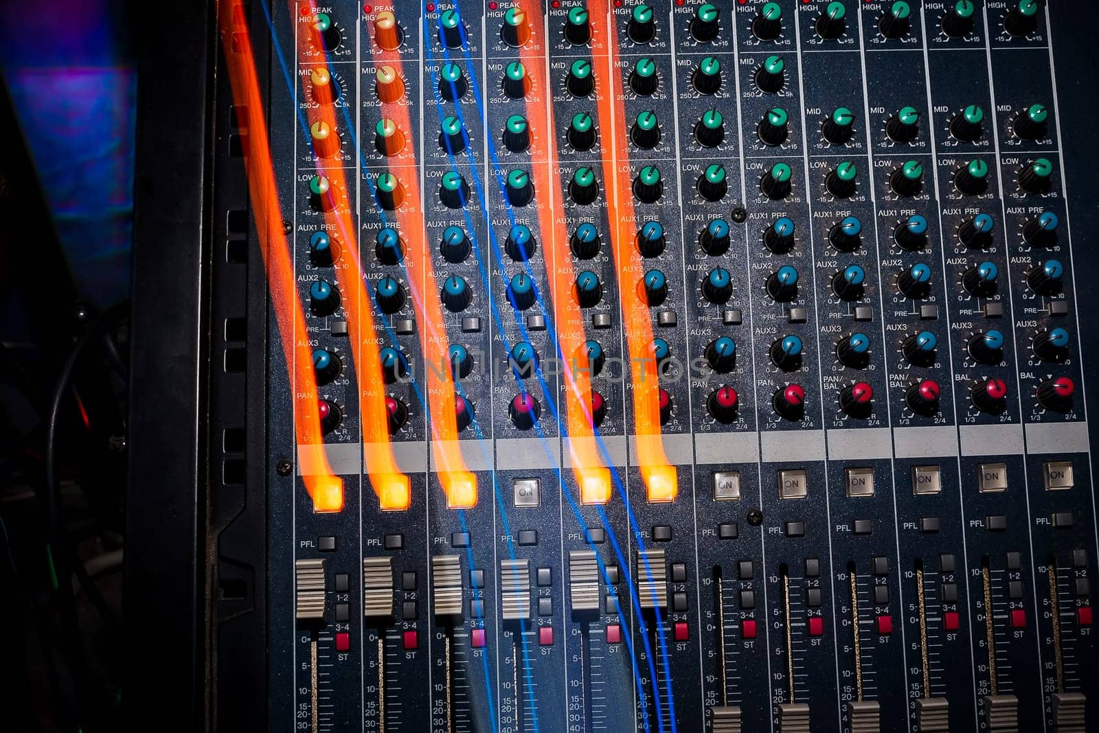 professional music equipment to create and mix music with volume levels and the volume of the music closeup
