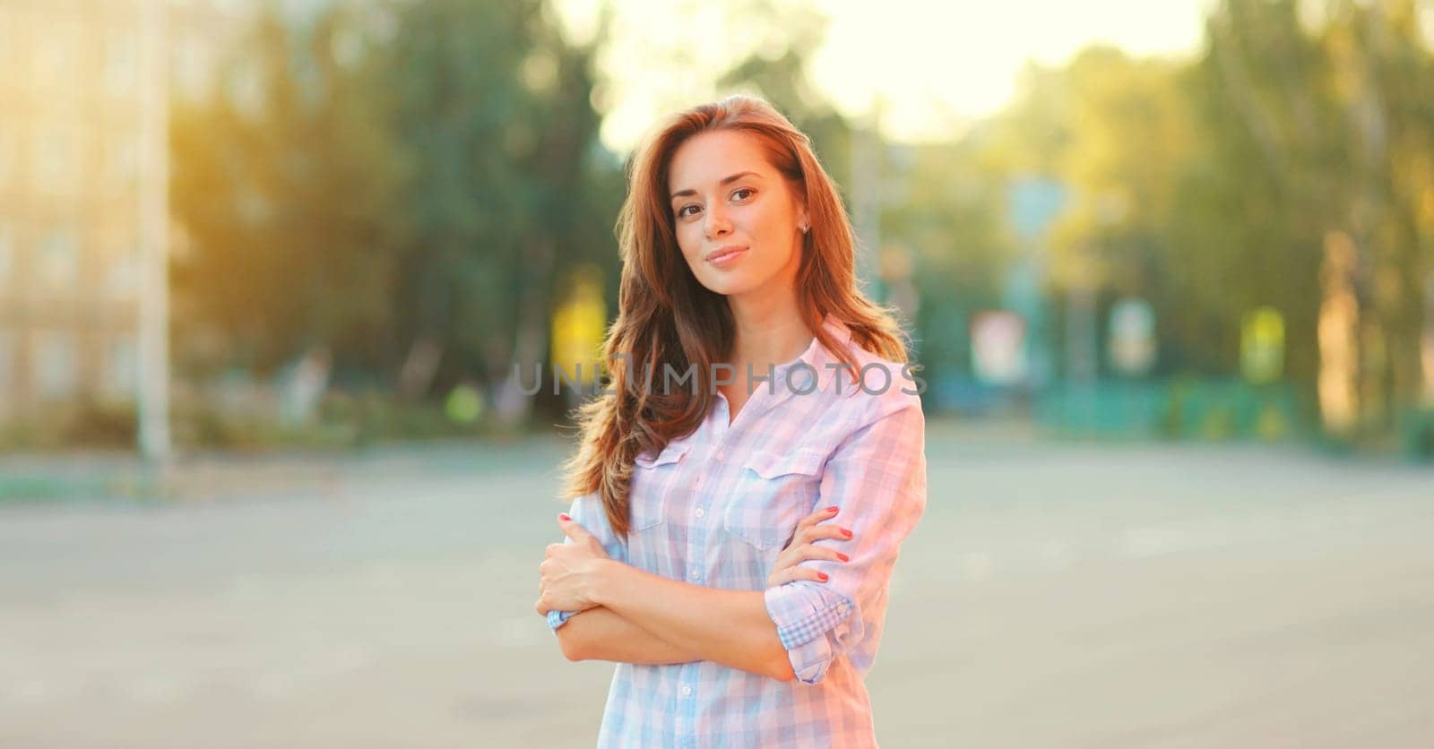 Portrait beautiful happy smiling brunette young woman posing in the city by Rohappy