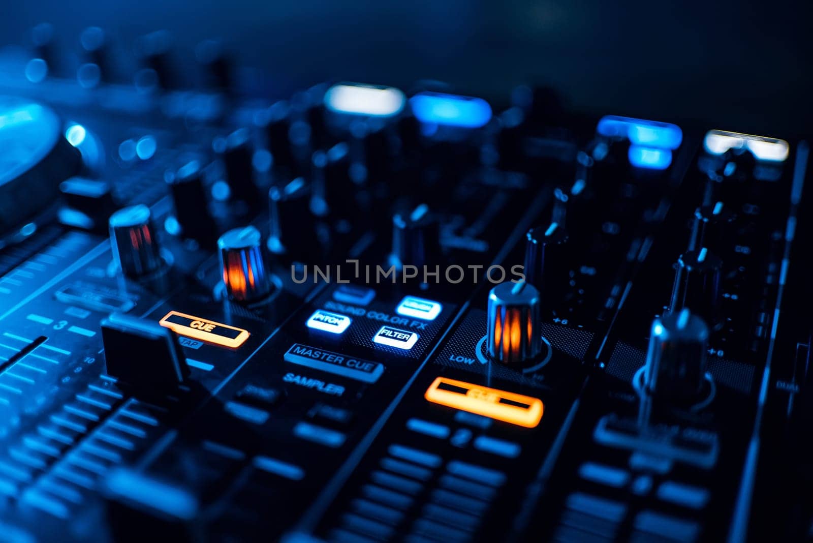 buttons mixer and control music on professional equipment DJ blue