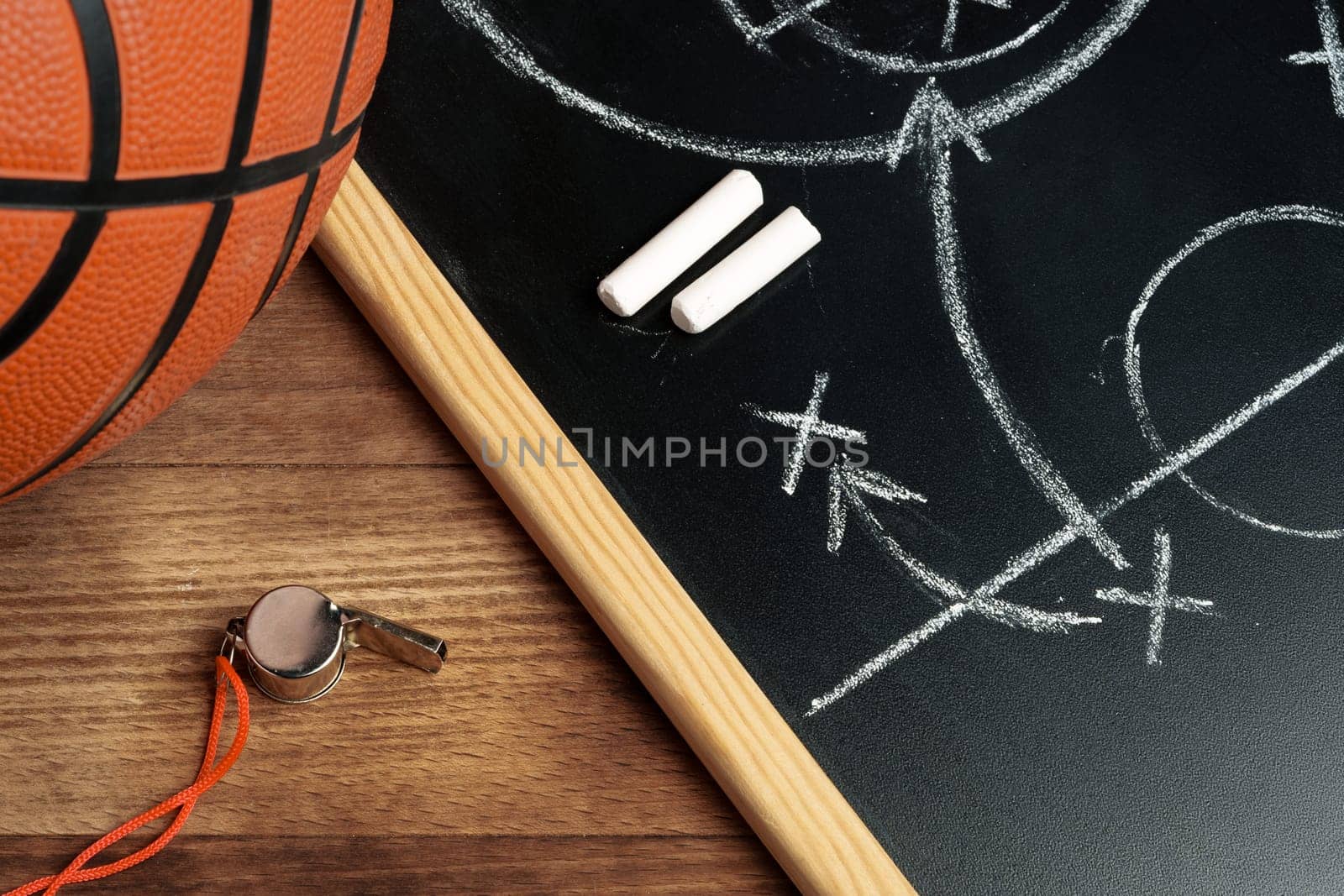 Basketball ball with chalkboard strategy planning close up by Fabrikasimf