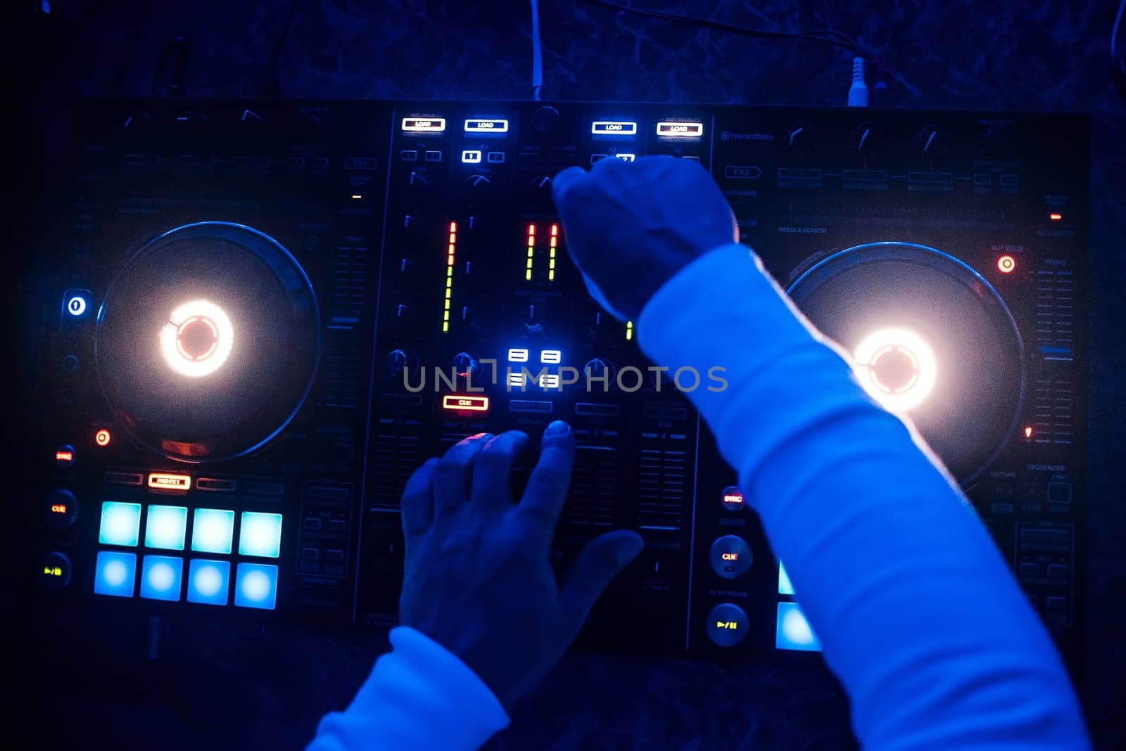 mixer and DJ booth in a night club with the owner for professional music managers top view
